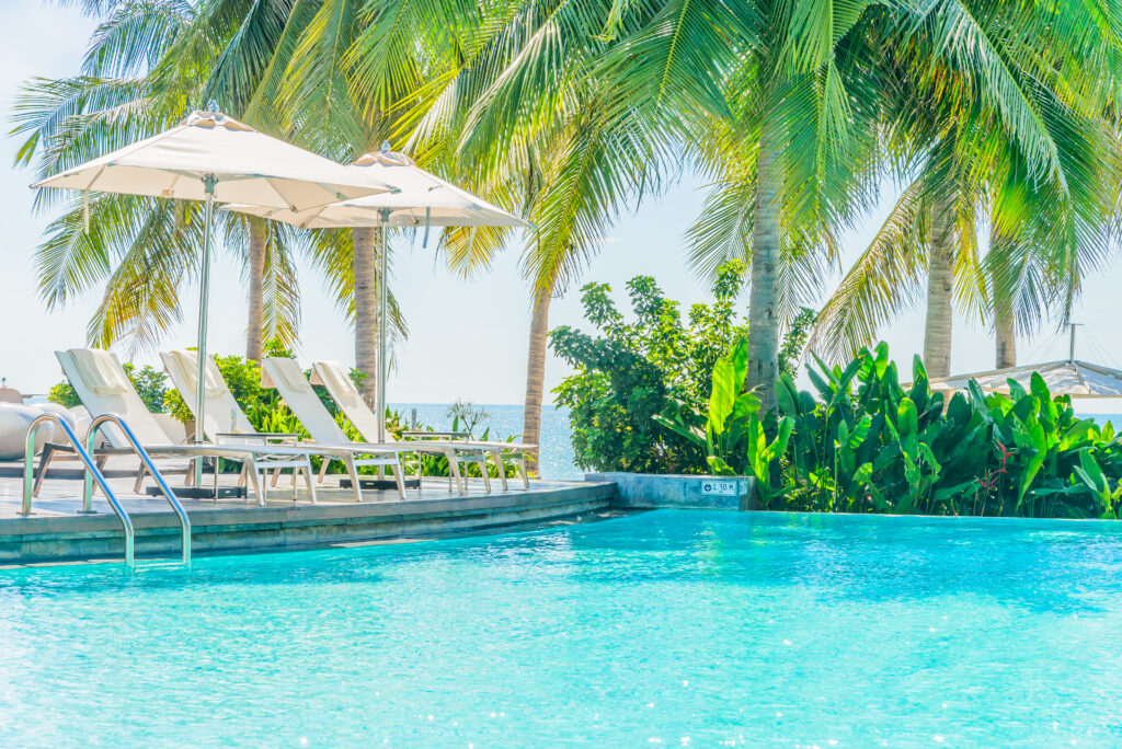 Umbrella with chair in hotel  swimming pool resort